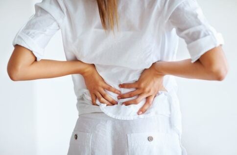 pain in the lower back in a woman